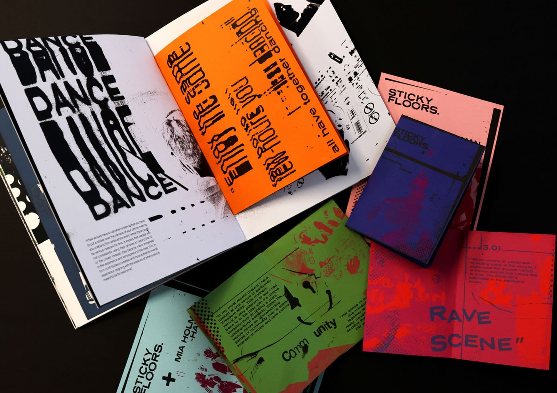 Several colourful printed materials, including magazines and posters, on a black background. The printed materials include a range of fonts and graphics, and words like: sticky floors, rave scene, and dance.